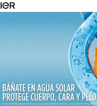 chica en biquini tomando el sol en la playa y agua solar de delial